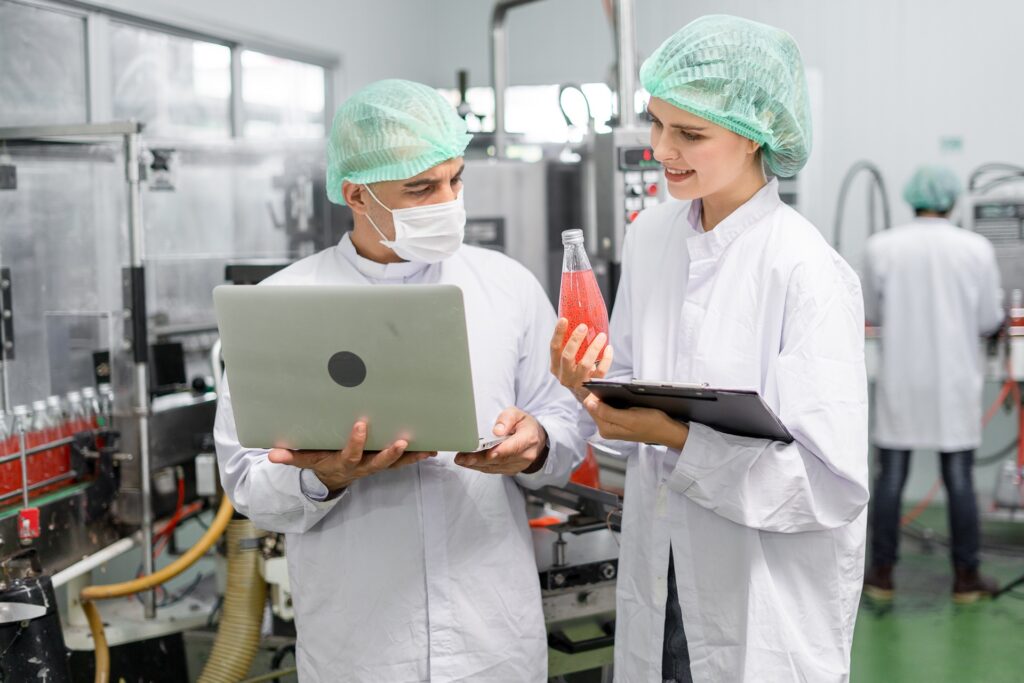 Food factory workers using food safety software